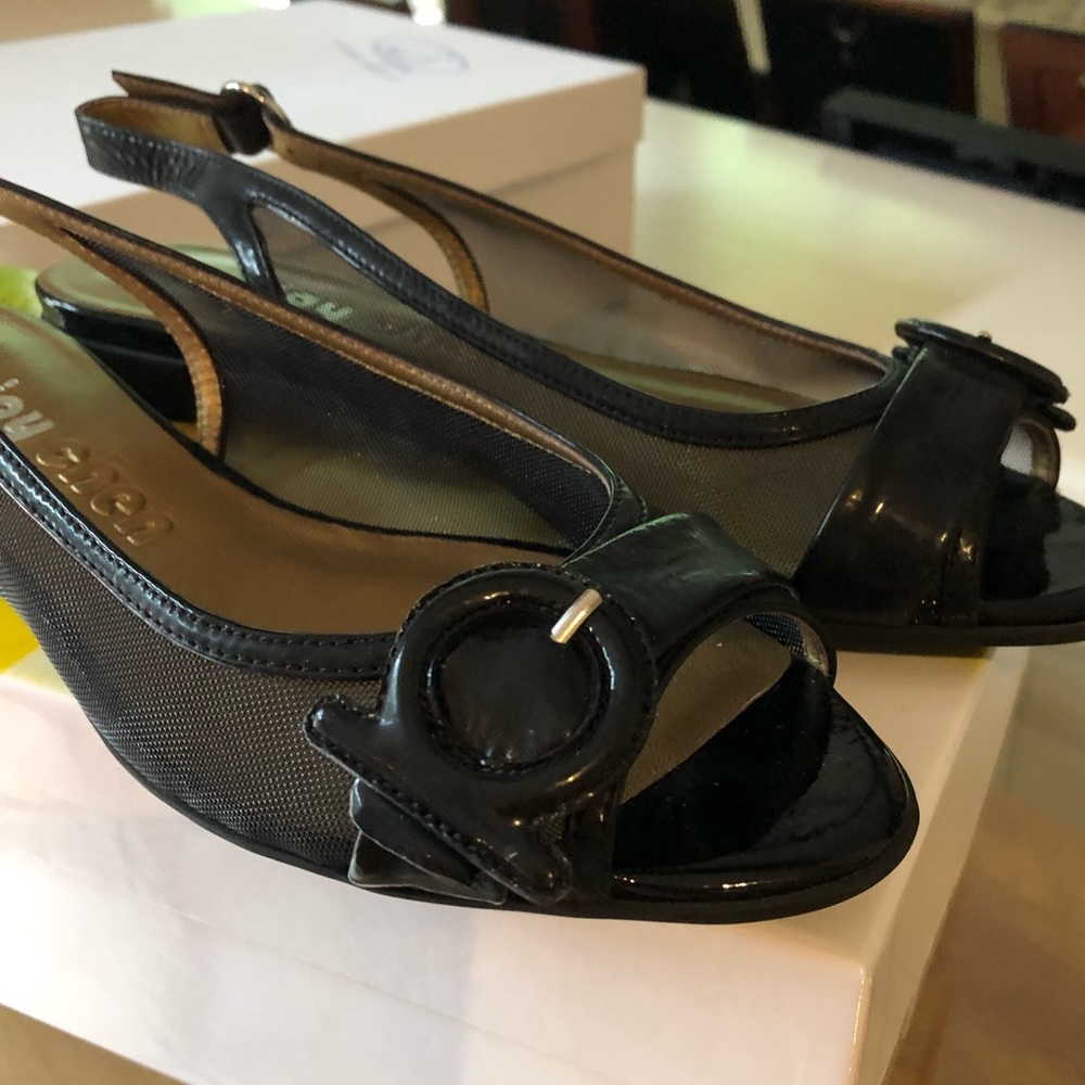 Black patent leather flats. Joy Chen.